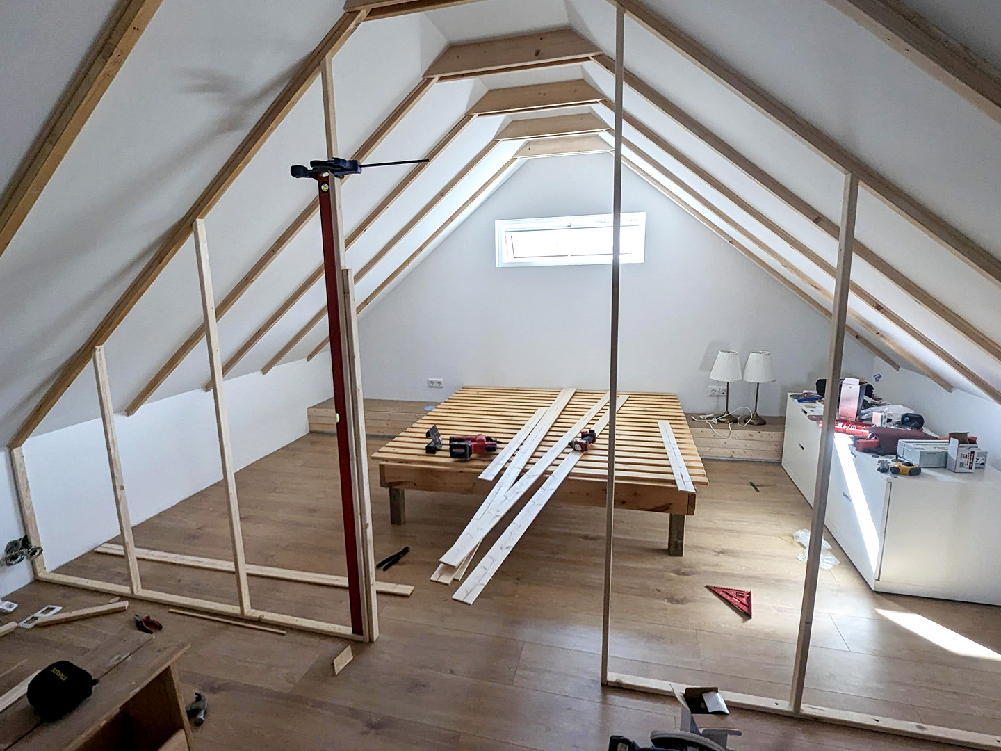 wooden mezzanine construction with windows and beds